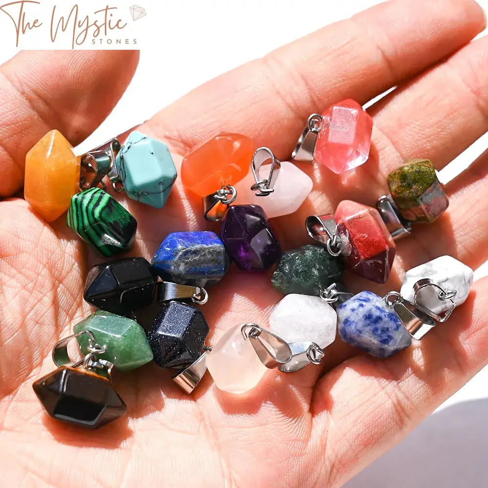 A set of five hexagonal healing crystal pendants displayed in various colors.