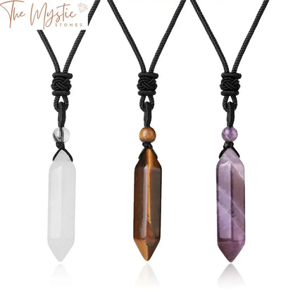 A handcrafted necklace featuring a polished hexagonal bullet-shaped pendant made from natural amethyst crystal.