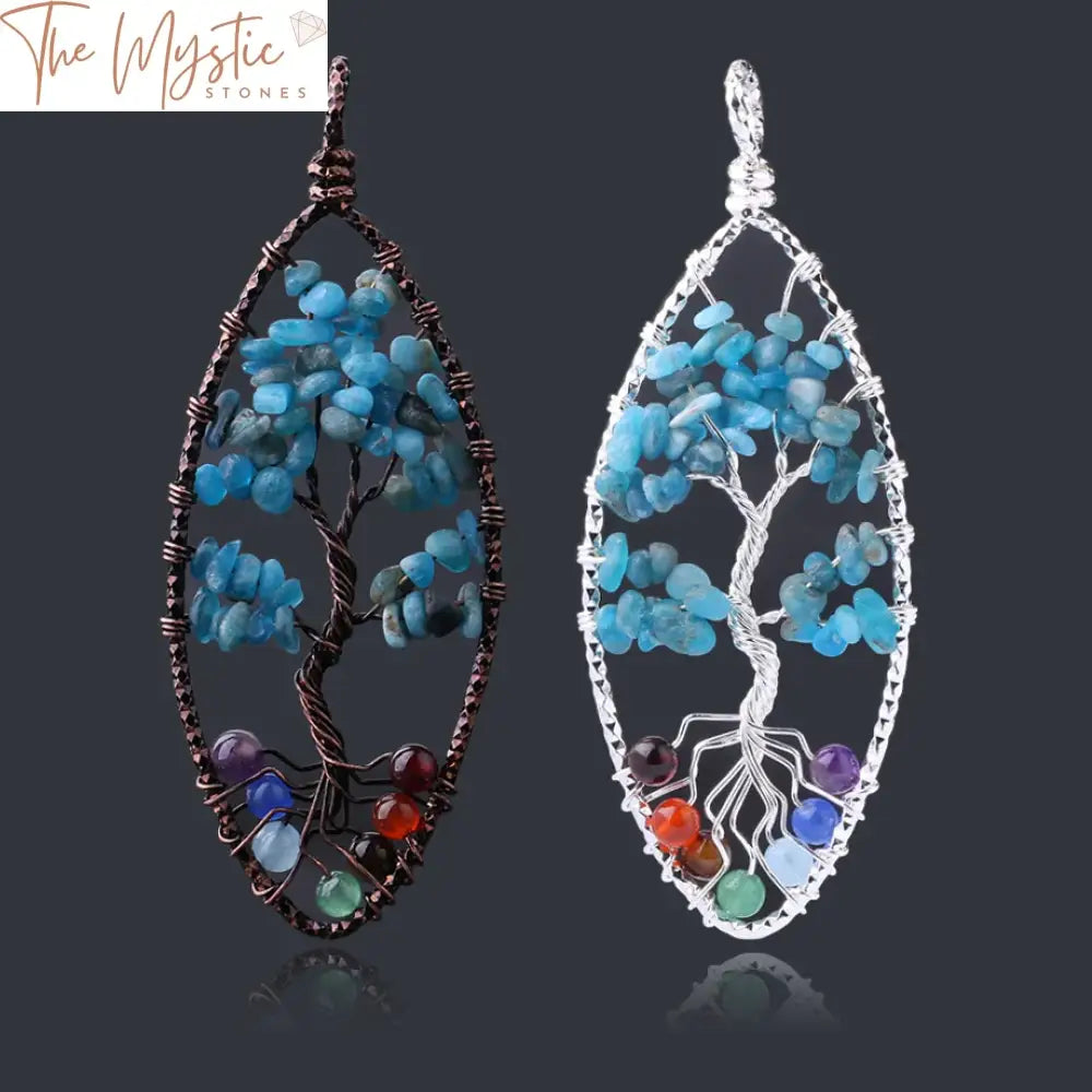 A wire-wrapped Tree of Life pendant featuring natural kyanite gemstone chip beads arranged to represent the seven chakras.