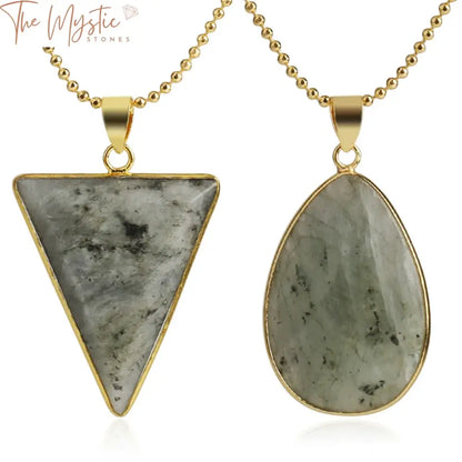 Three triangular pendants featuring spectrolite labradorite stones are displayed against a neutral background.