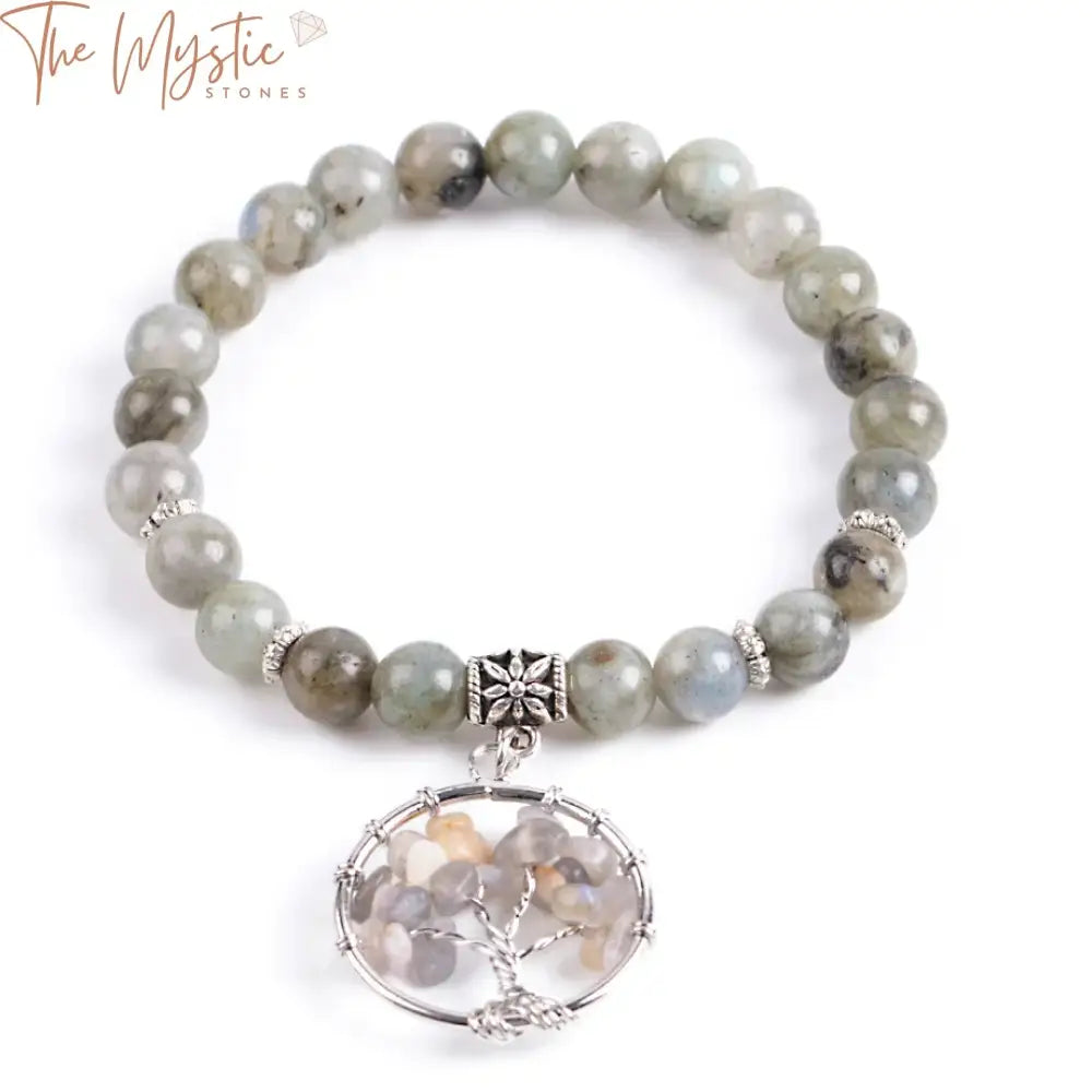 A beaded bracelet featuring 8mm spectrolite labradorite stones with a detailed silver "Tree of Life" charm.