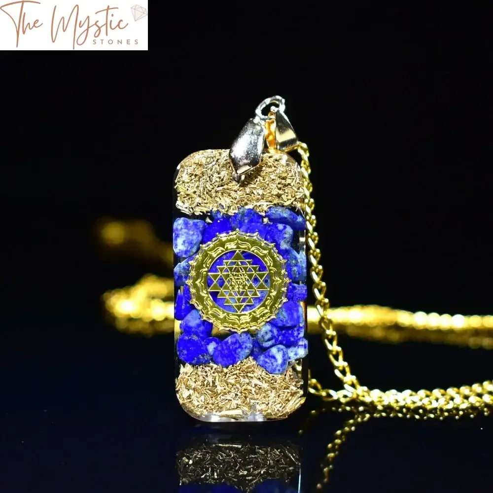 A resin pendant featuring natural lapis lazuli chip stones and gold foil, designed in a circular shape.