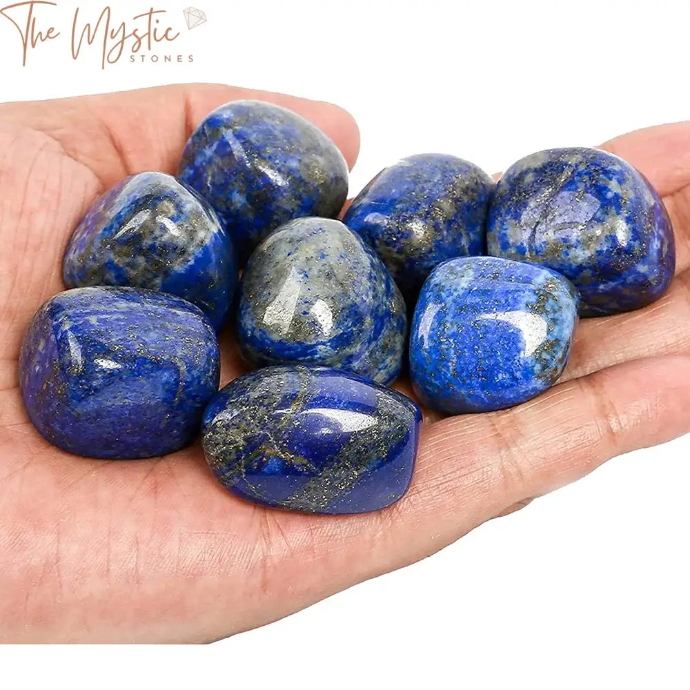 A collection of smooth, polished lapis lazuli tumbled stones, each ranging from 20 to 30mm in size.