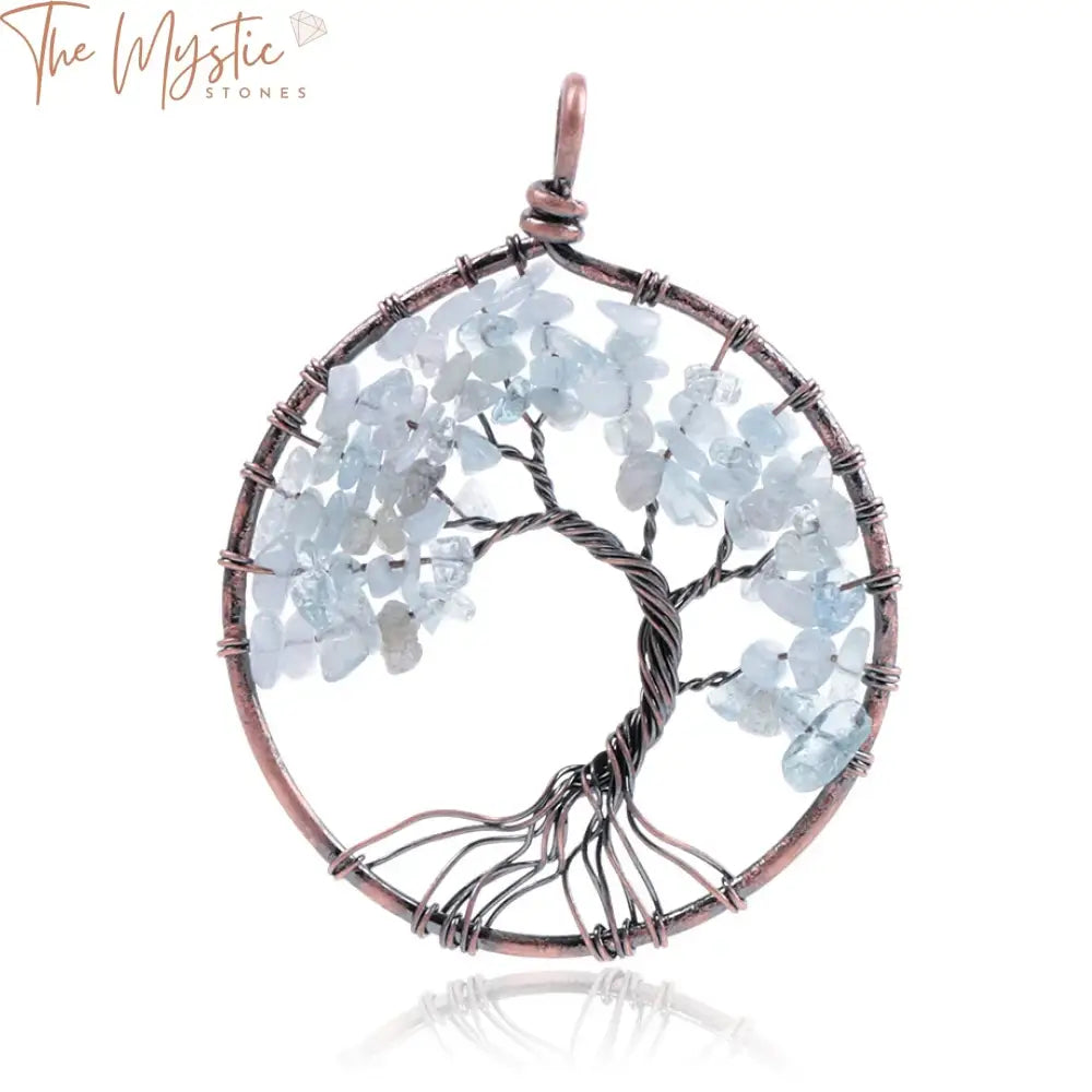 A handmade Tree of Life pendant featuring a network of wire branches elegantly wrapped around a circular frame.