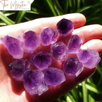 A close-up image of a natural, unique lavender amethyst quartz crystal point with a smooth and glossy surface.