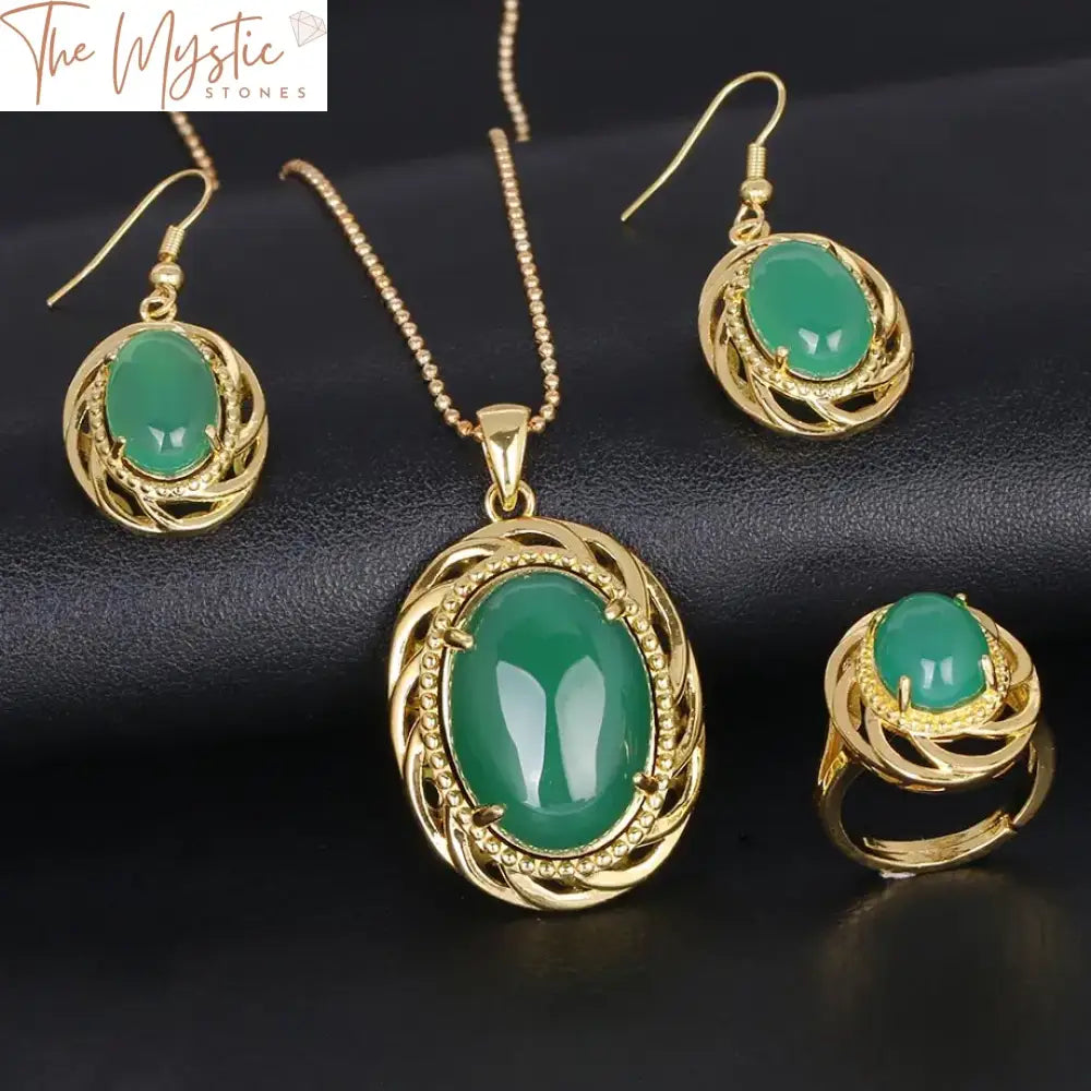 A jewelry set featuring a necklace, earrings, and rings made of natural Malay green jade paired with rich red agates.