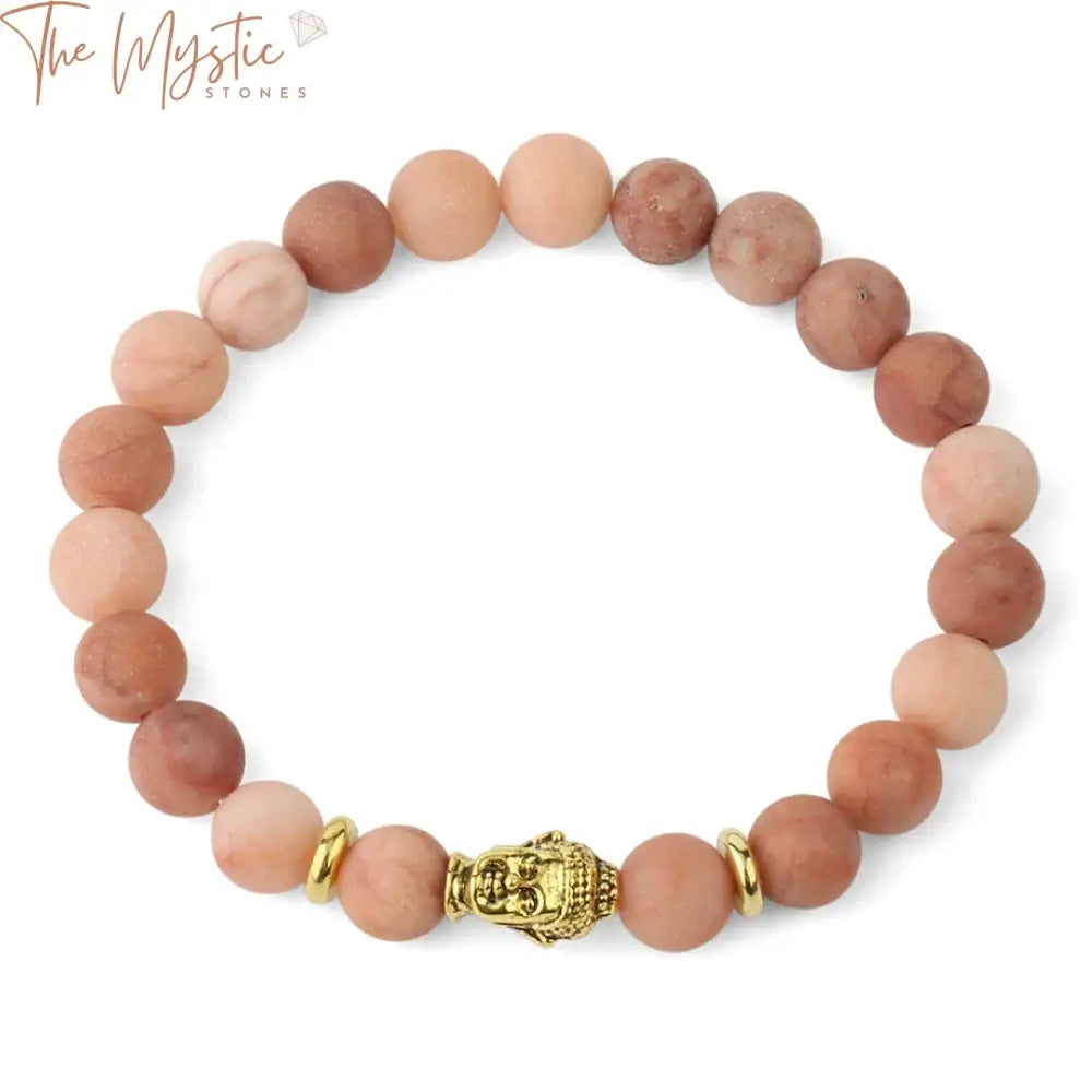 A close-up image of a yoga bracelet featuring matte pink aventurine stones.