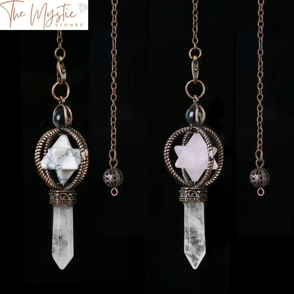 A collection of crystal pendulums displayed on a textured gray surface.