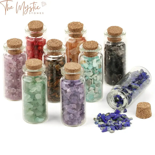 A collection of mini glass bottles filled with small, natural chip tumble stones in assorted colors.