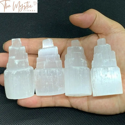 A 2.4-inch mini natural selenite tower with a translucent, milky-white appearance, shaped like a small skyscraper.