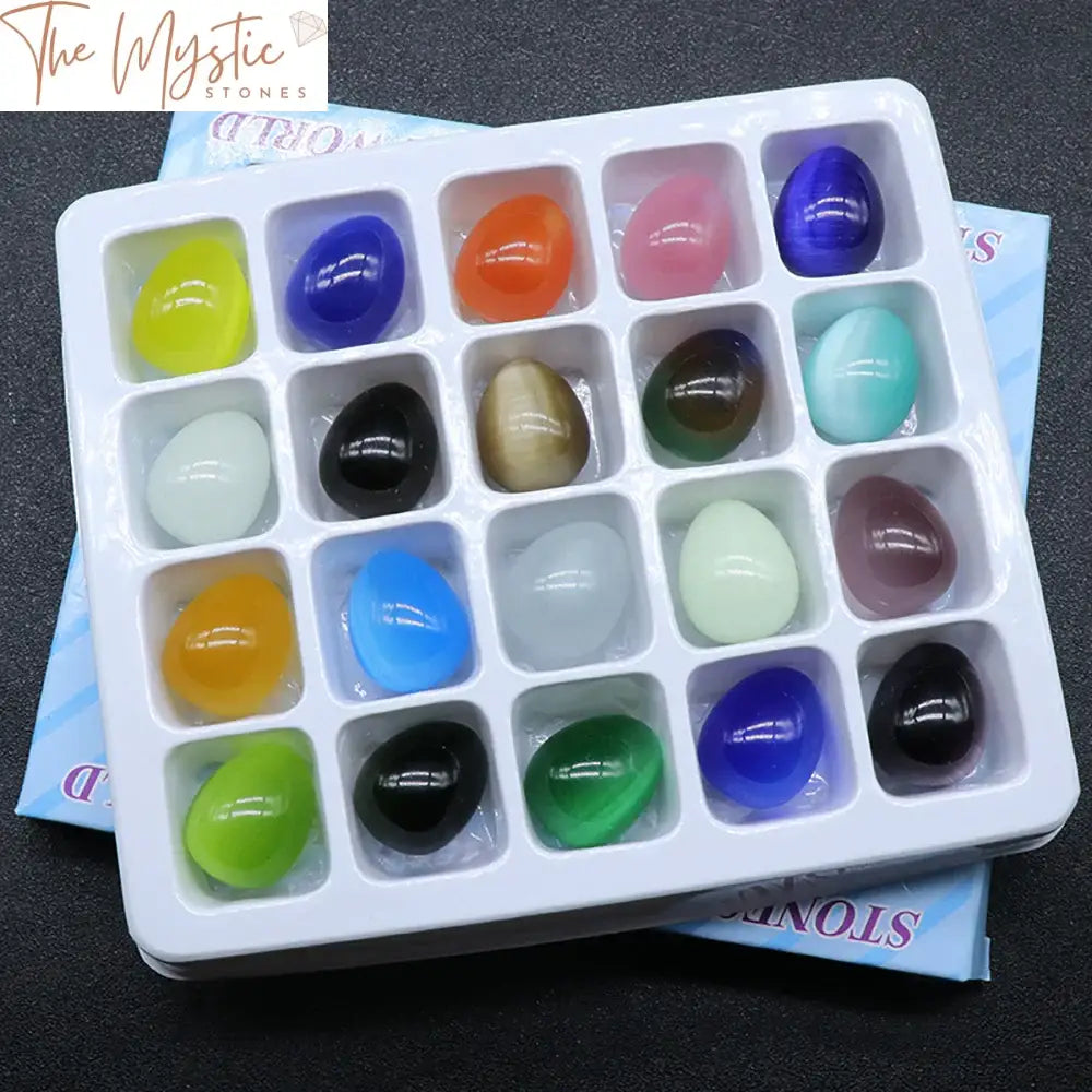 A set of 20 polished egg-shaped stones in various colors, resembling cat's eye crystals.