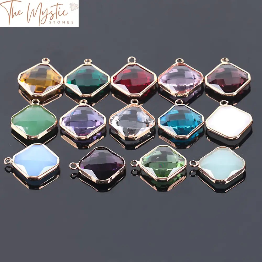 A collection of ten 19mm quadrilateral glass beads in assorted colors arranged in a circle.