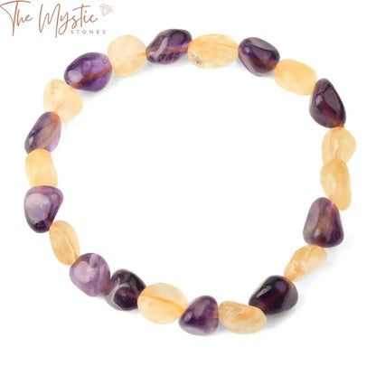 A collection of mixed crystal stretch bracelets featuring irregularly shaped purple and yellow tumbled beads.