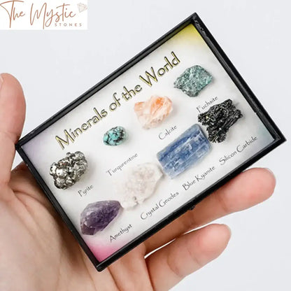 A collection of various natural crystal stones and gemstones displayed on a wooden tray.