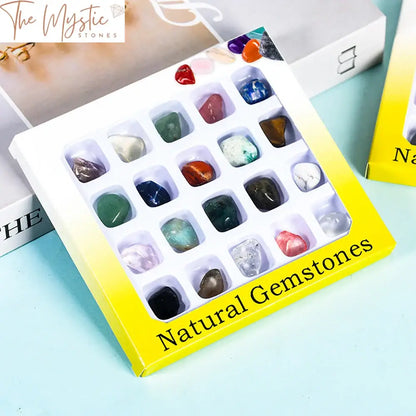 A collection of 20 assorted natural crystals and tumbled stones displayed on a black background.