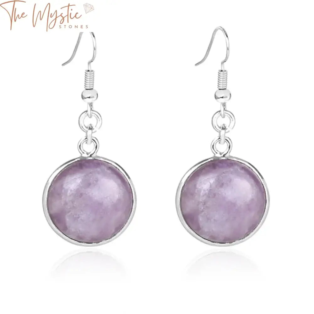 A pair of drop earrings featuring round natural gemstones.