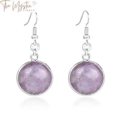 A pair of drop earrings featuring round natural gemstones.