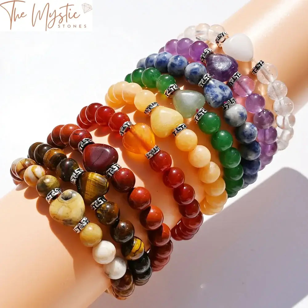 A bracelet made of handmade 8mm natural stone round beads, showcasing a variety of colors representing different chakras.