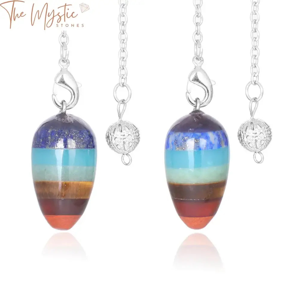 A vibrant collection of natural stone pendulums is displayed, each in the shape of a small gyro egg.