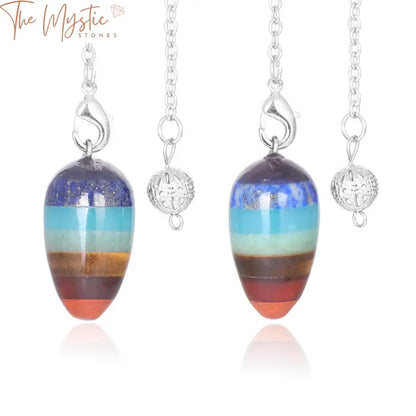 A vibrant collection of natural stone pendulums is displayed, each in the shape of a small gyro egg.