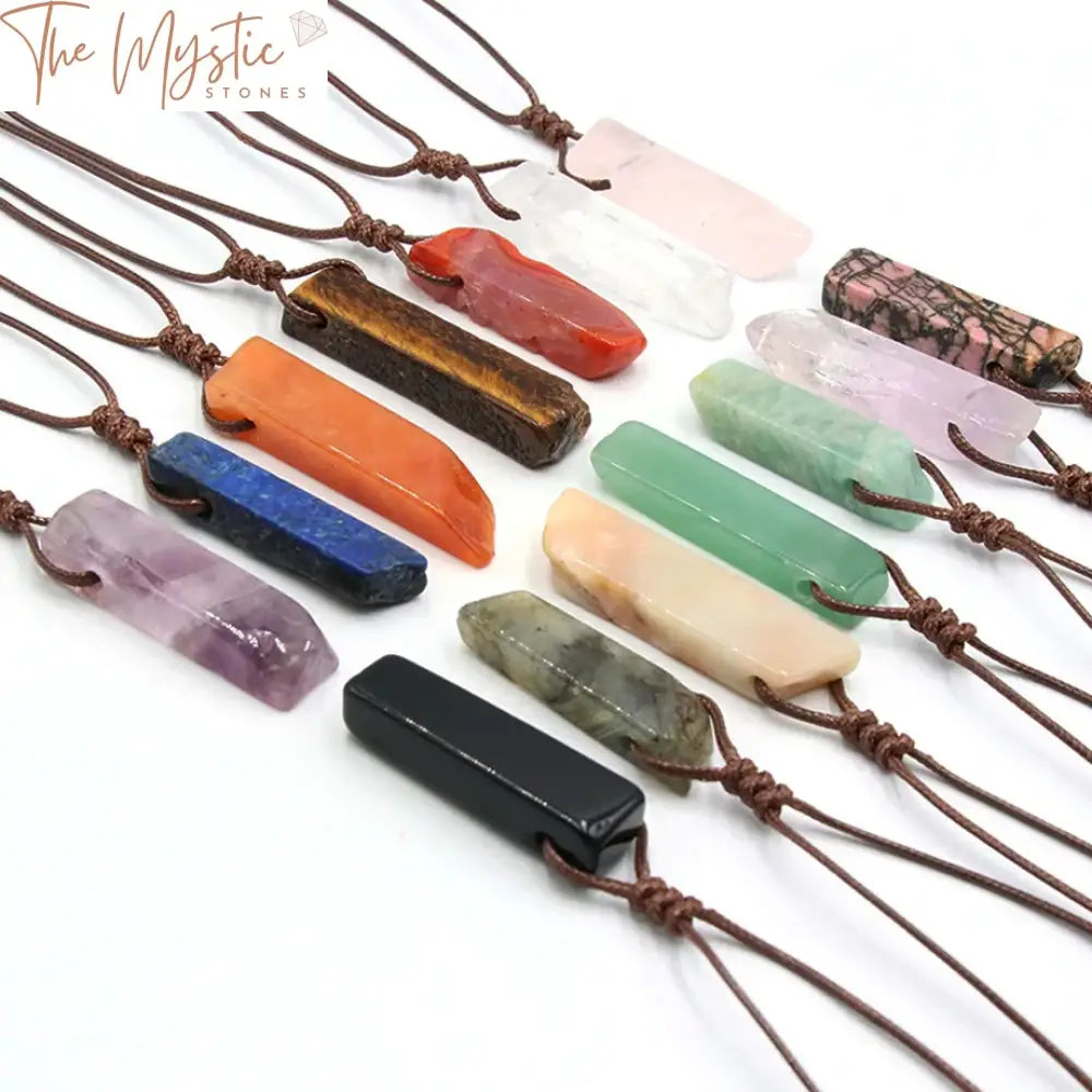 A variety of healing crystal necklaces are displayed, featuring irregularly shaped natural stone slice pendants.