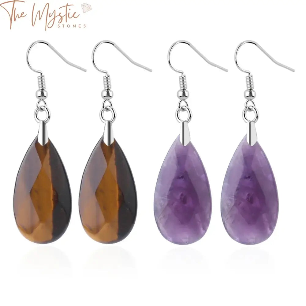 A pair of elegant earrings featuring natural stone pendants shaped like water droplets.