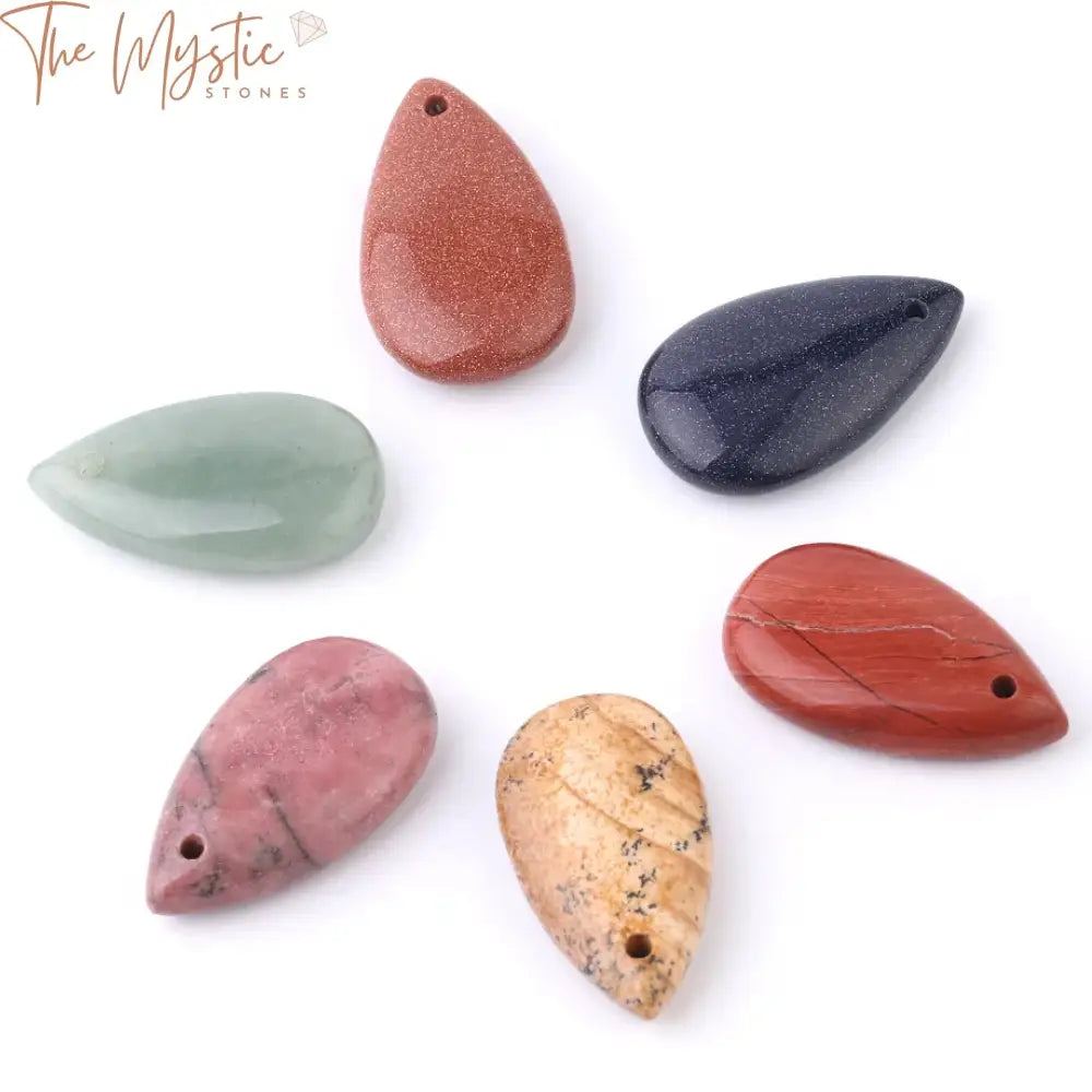 A variety of water drop-shaped natural stone pendants are displayed, highlighting their diverse colors and textures.