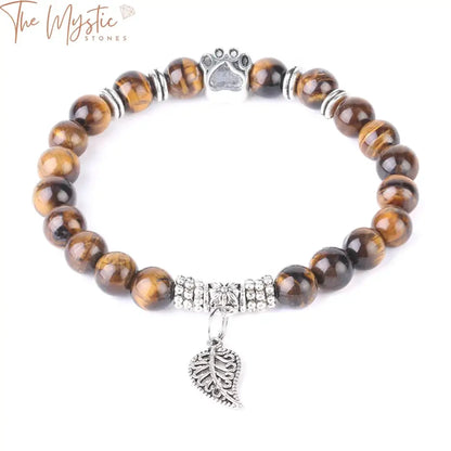 A bracelet composed of natural stone mala beads featuring obsidian, Indian onyx, and tiger eye stones, designed for men.