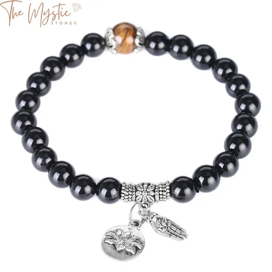 A black elastic beaded bracelet featuring a combination of large tiger eye beads and matte obsidian stones.