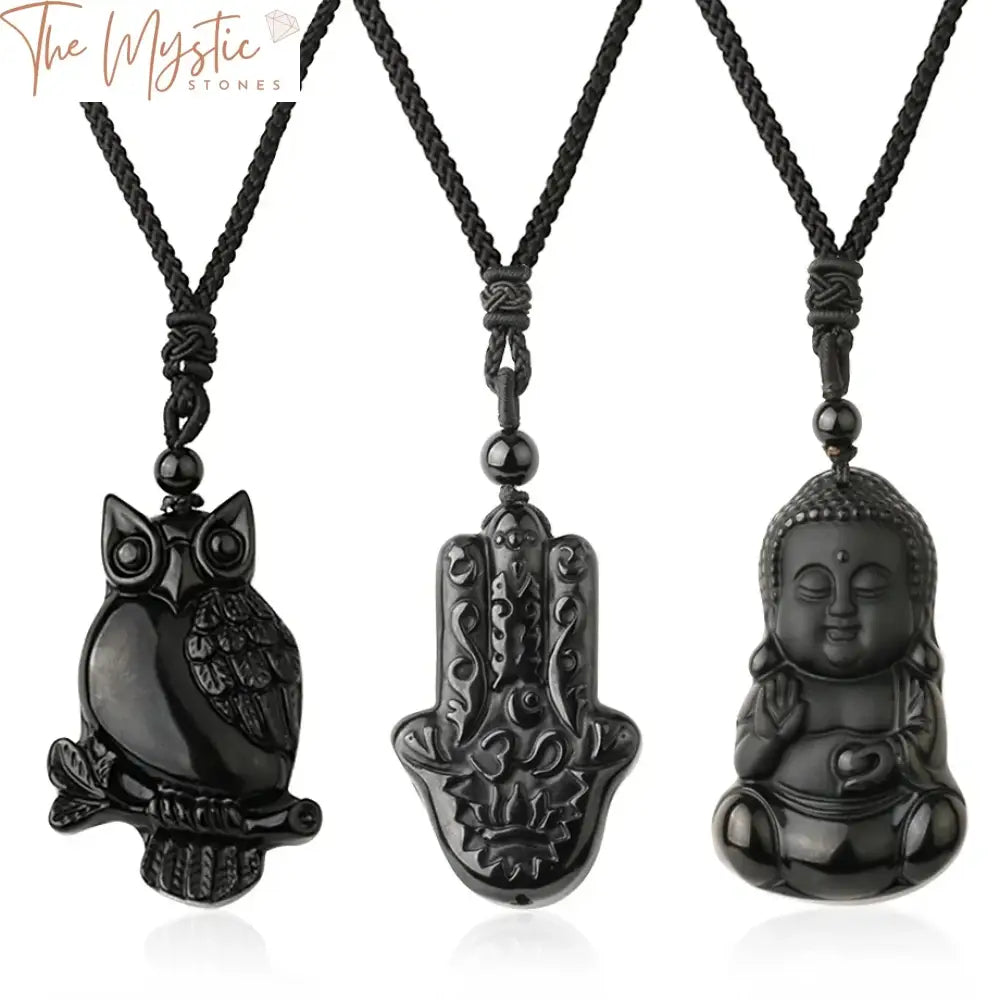 A black obsidian necklace featuring a central wolf pendant delicately carved from natural stone.