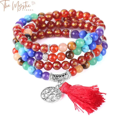 A 108 mala bead bracelet crafted with 6mm natural onyx stones, featuring colorful beads representing the 7 chakras.