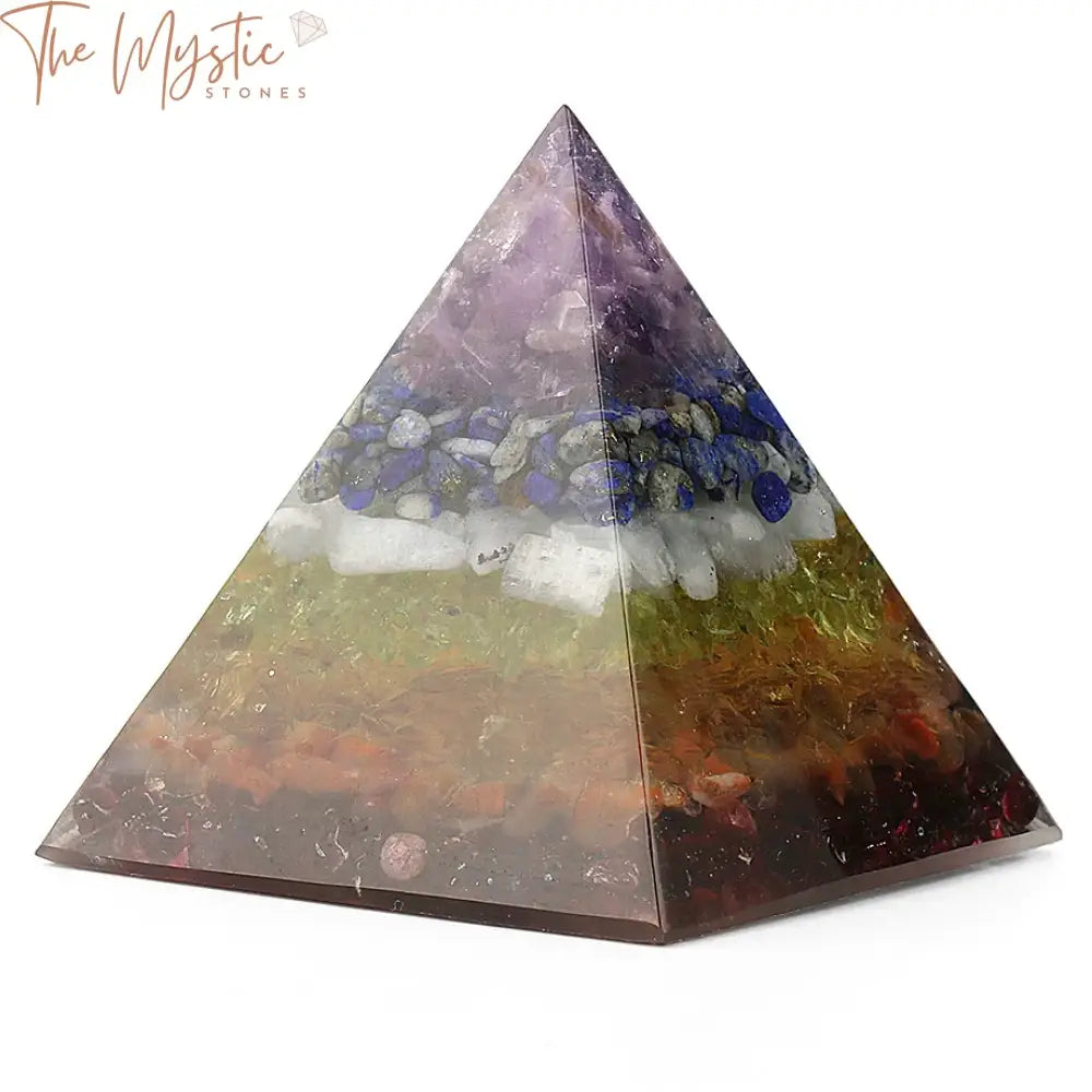 A decorative orgonite pyramid featuring a glossy resin finish, embedded with a variety of natural gravel stones.