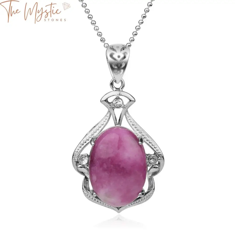 A pink cabochon bead pendant necklace with an oval-shaped natural stone.