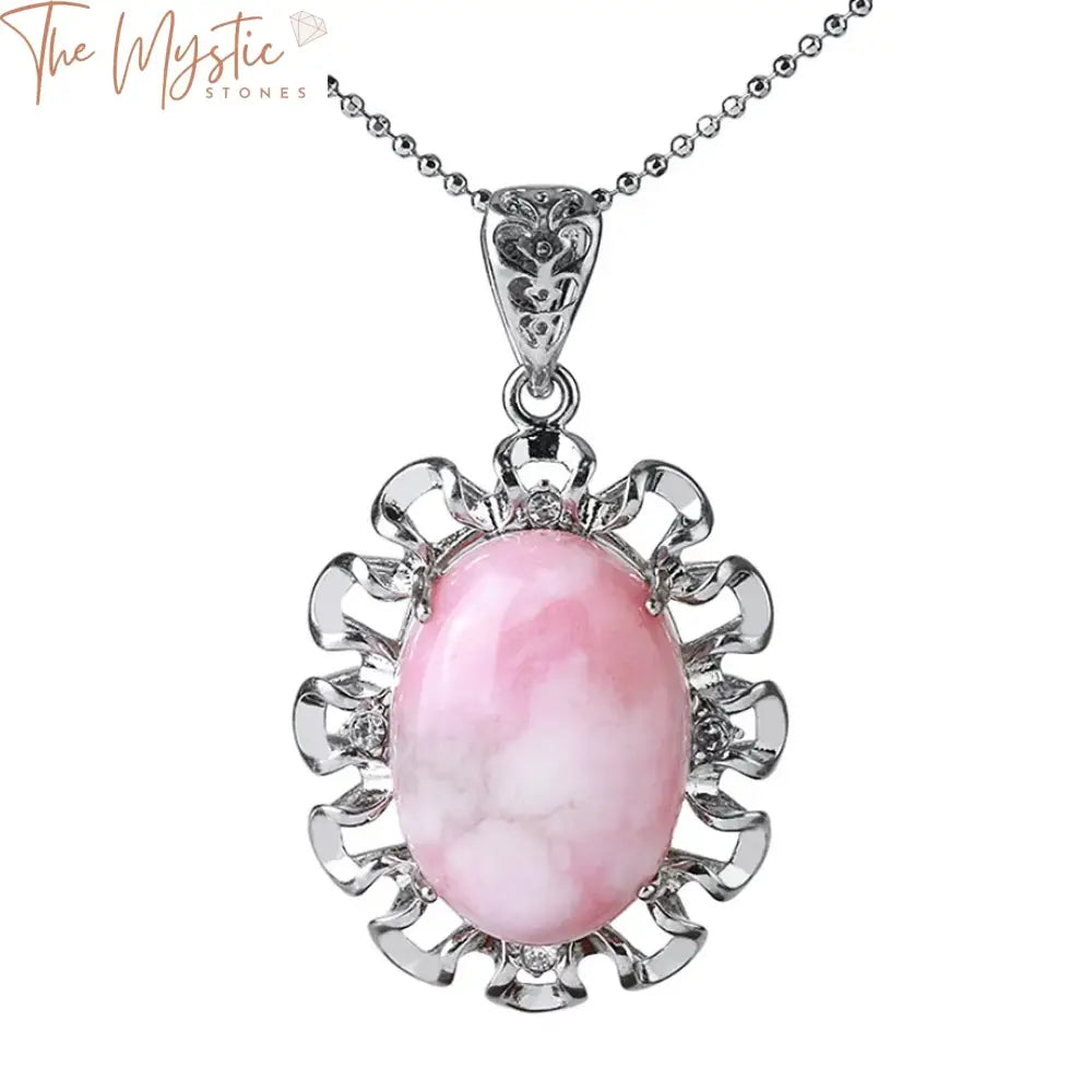 A close-up image of a Healing Oval Pendant Necklace showcasing a beautiful natural stone pink crystal cabochon at its center.