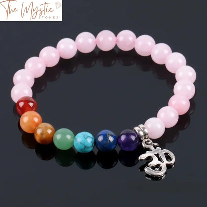 A collection of 7 chakra bracelets featuring pink crystal quartz beads, each measuring 8mm.