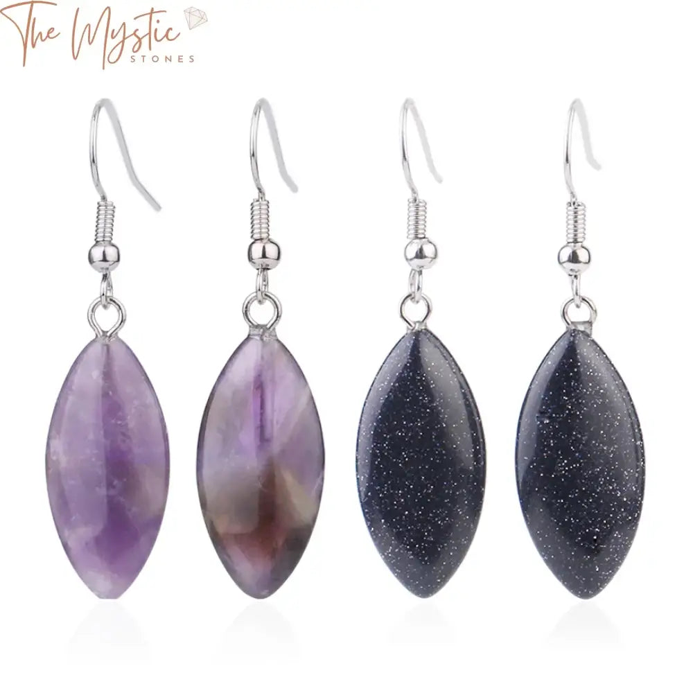 A pair of natural stone dangle earrings featuring horse-eye-shaped pink and purple crystal quartz stones.