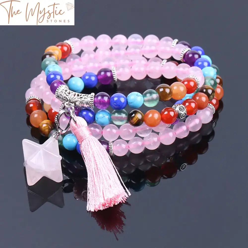 A strand of 108 pink quartz crystal beads is intricately arranged to form a versatile bracelet or necklace.