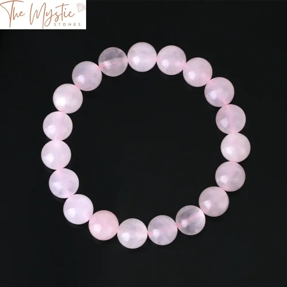 A delicate handmade bracelet composed of natural pink rose crystal beads in varying sizes of 4mm, 6mm, 8mm, and 10mm.