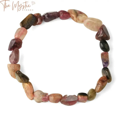 A collection of colorful pink tourmaline stretch bracelets made from natural raw stone nuggets and chip beads.