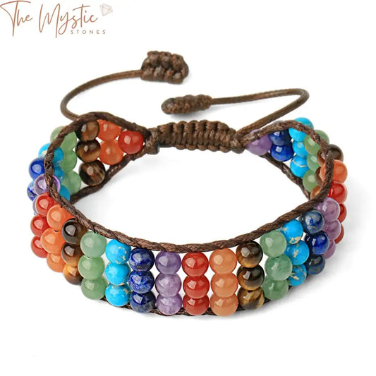 A multilayer wrap bracelet featuring 6mm round beads made from purple crystal stones, designed to represent the 7 chakras.