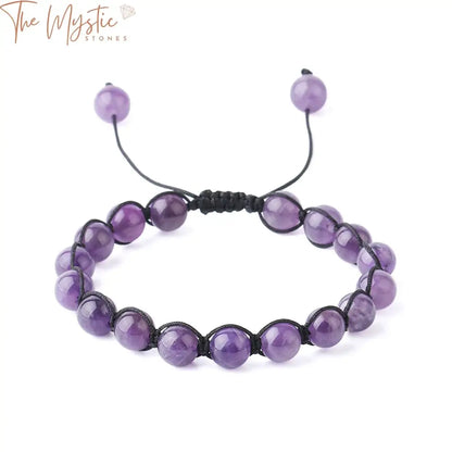 A stylish braided rope bracelet featuring 8mm purple crystal stones, each emitting a subtle glow.