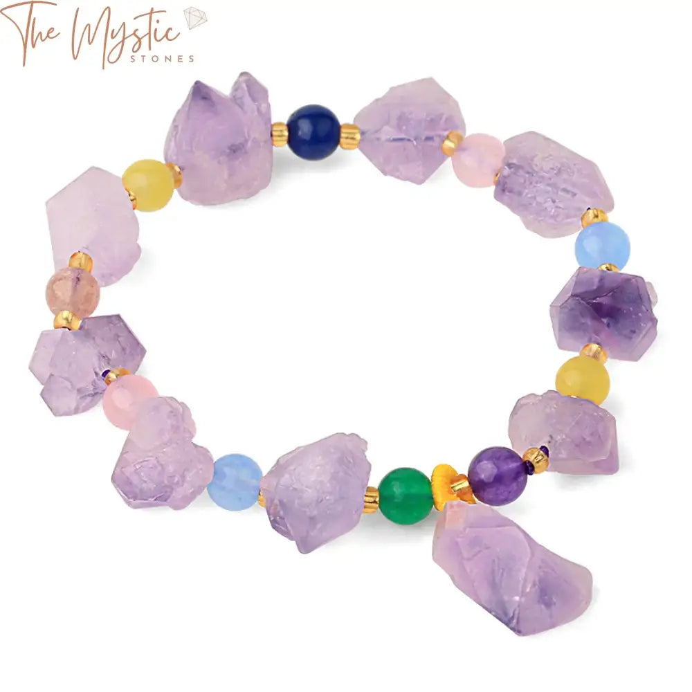 A collection of purple crystal bracelets displayed neatly, featuring irregularly shaped natural stone beads.