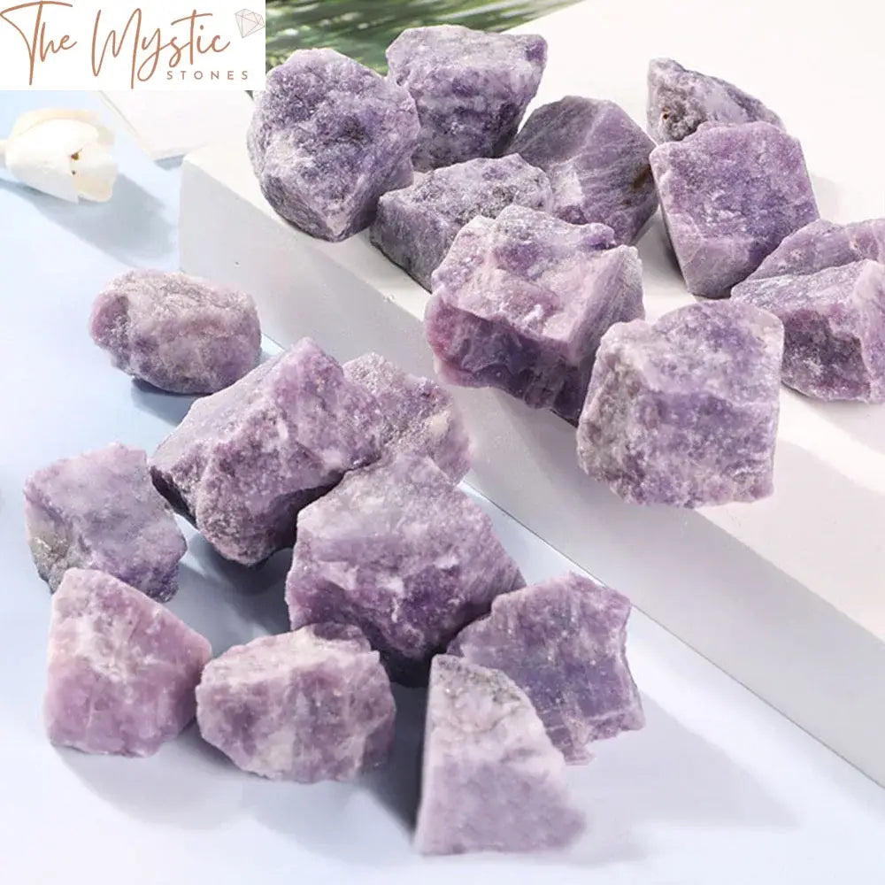 A rough, natural purple Lepidolite stone with a rich, deep violet hue is displayed prominently.