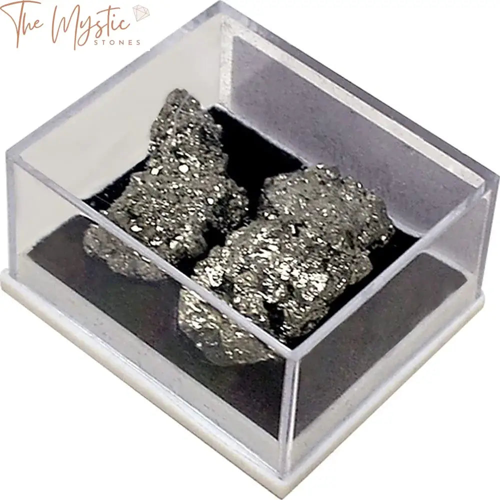 A small open box displaying a collection of raw pyrite crystal stones.