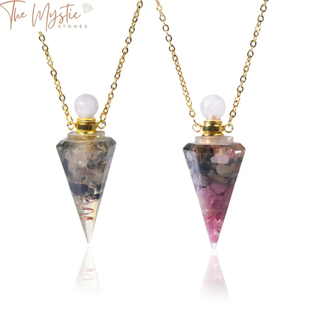 A close-up image of a stylish pendant necklace showcasing a gold-colored chain with a geometric, transparent resin pendant.