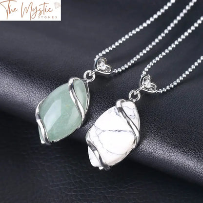 A collection of natural stone quartz crystal necklaces featuring variously shaped pendants.