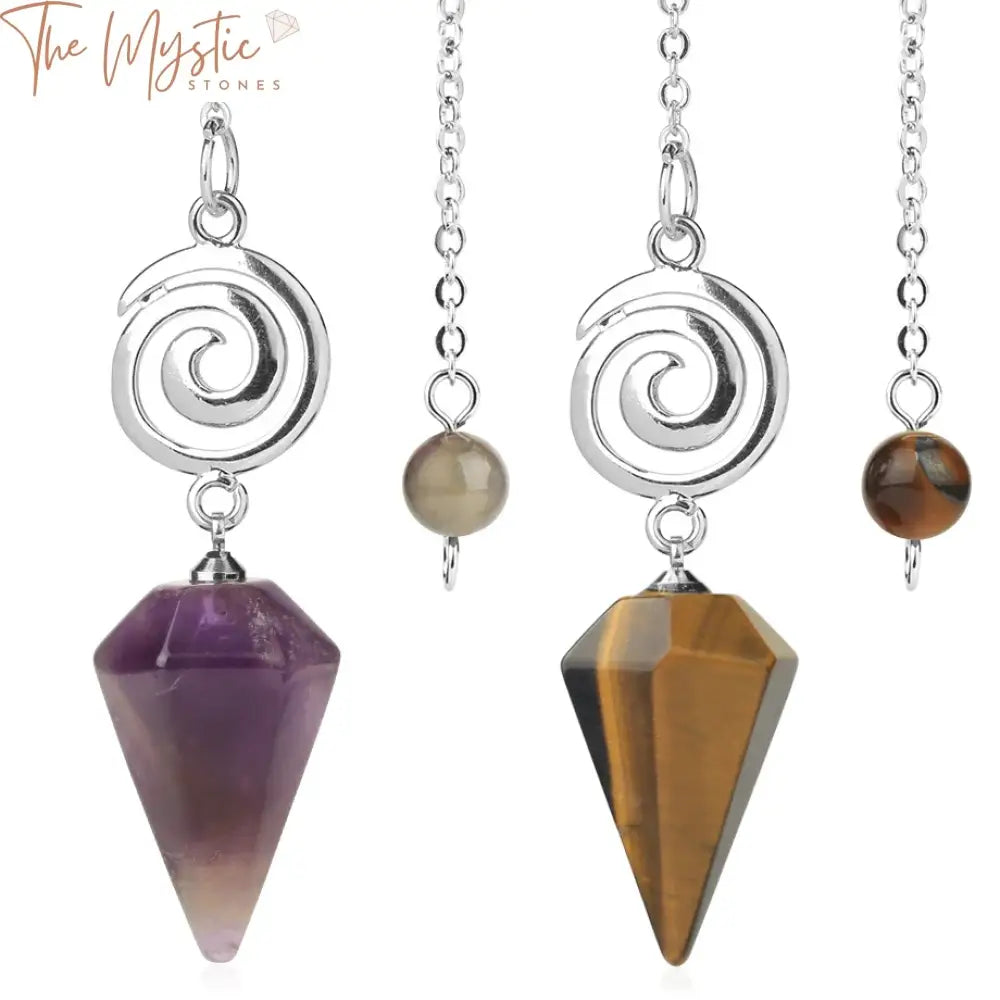 A selection of crystal pendulums neatly displayed on a neutral background.