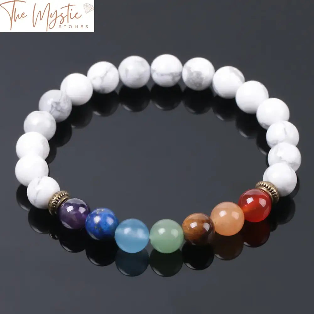 A Rainbow 7 Chakra bracelet featuring white howlite beads, accented with colorful beads representing the chakras.