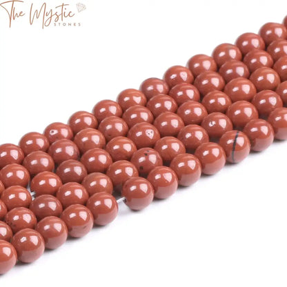 A close-up image of natural red stone loose beads in round ball shapes, available in 4mm, 6mm, and 8mm sizes.