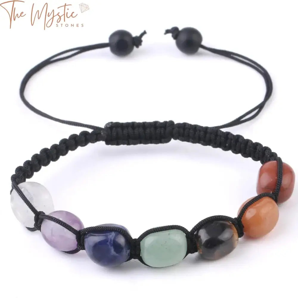 A handmade bracelet featuring an array of irregular natural stones, each representing the seven chakras.